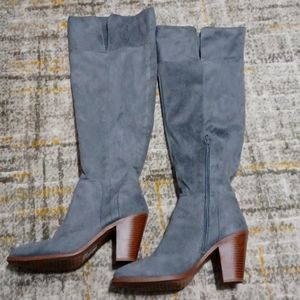 Faux suede thigh high boots. The height of the boot stops on the knee.